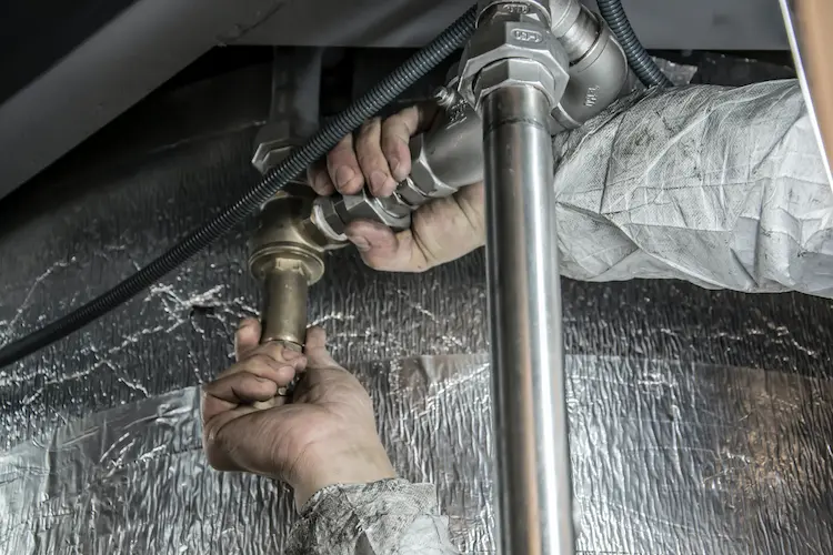 Plumber fixing drainage
